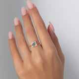 Tilted Sky Blue Sapphire with Diamond Frame Engagement Ring