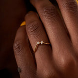 Curved Wedding Band Embellished with a Baguette and a Brilliant Diamond