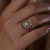 Curved Wedding Band Embellished with a Baguette and a Brilliant Diamond